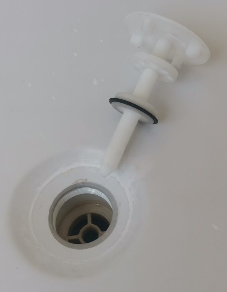 Image of a special drain plug for a jetted house bath. Plug and Suction is in one unit